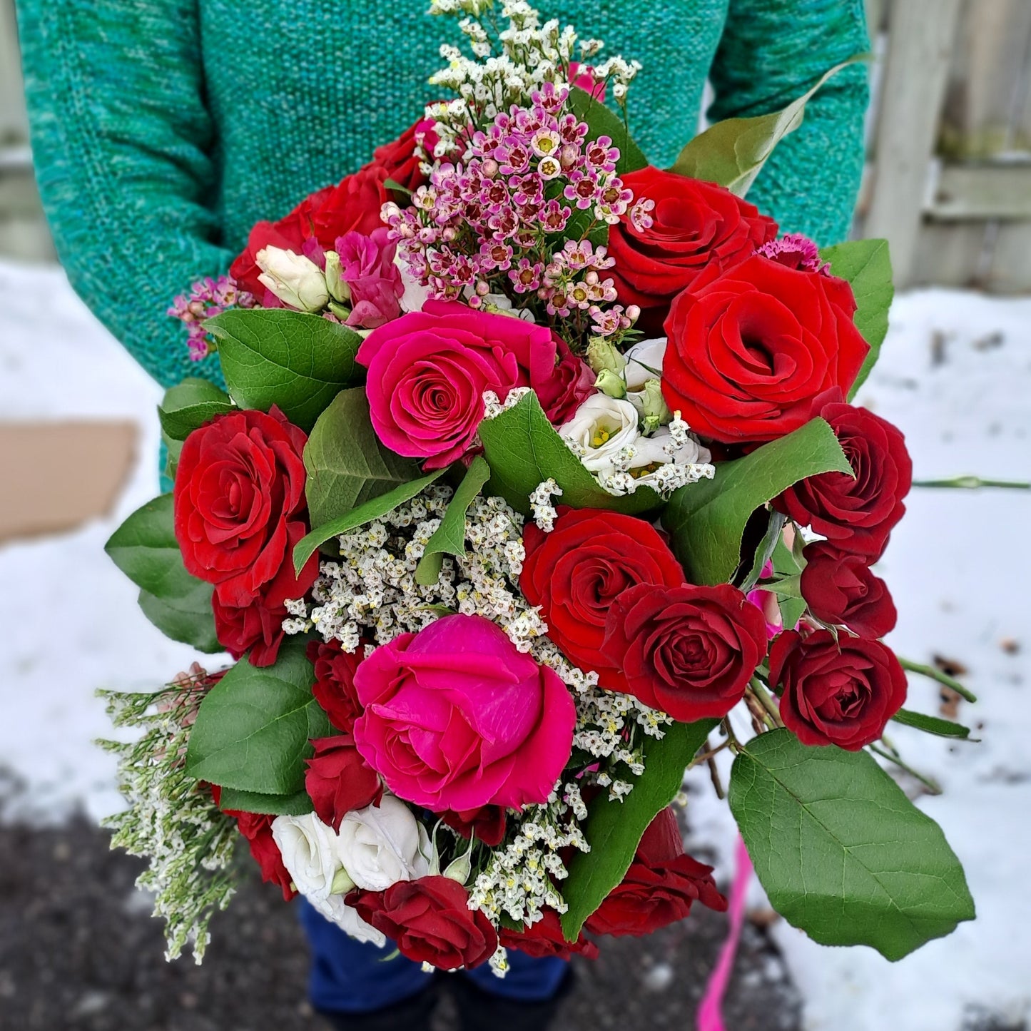 Bouquet of red and pink roses for brides