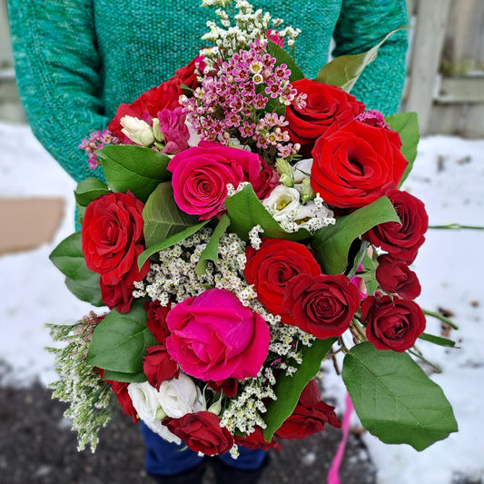 Bouquet of red and pink roses for brides